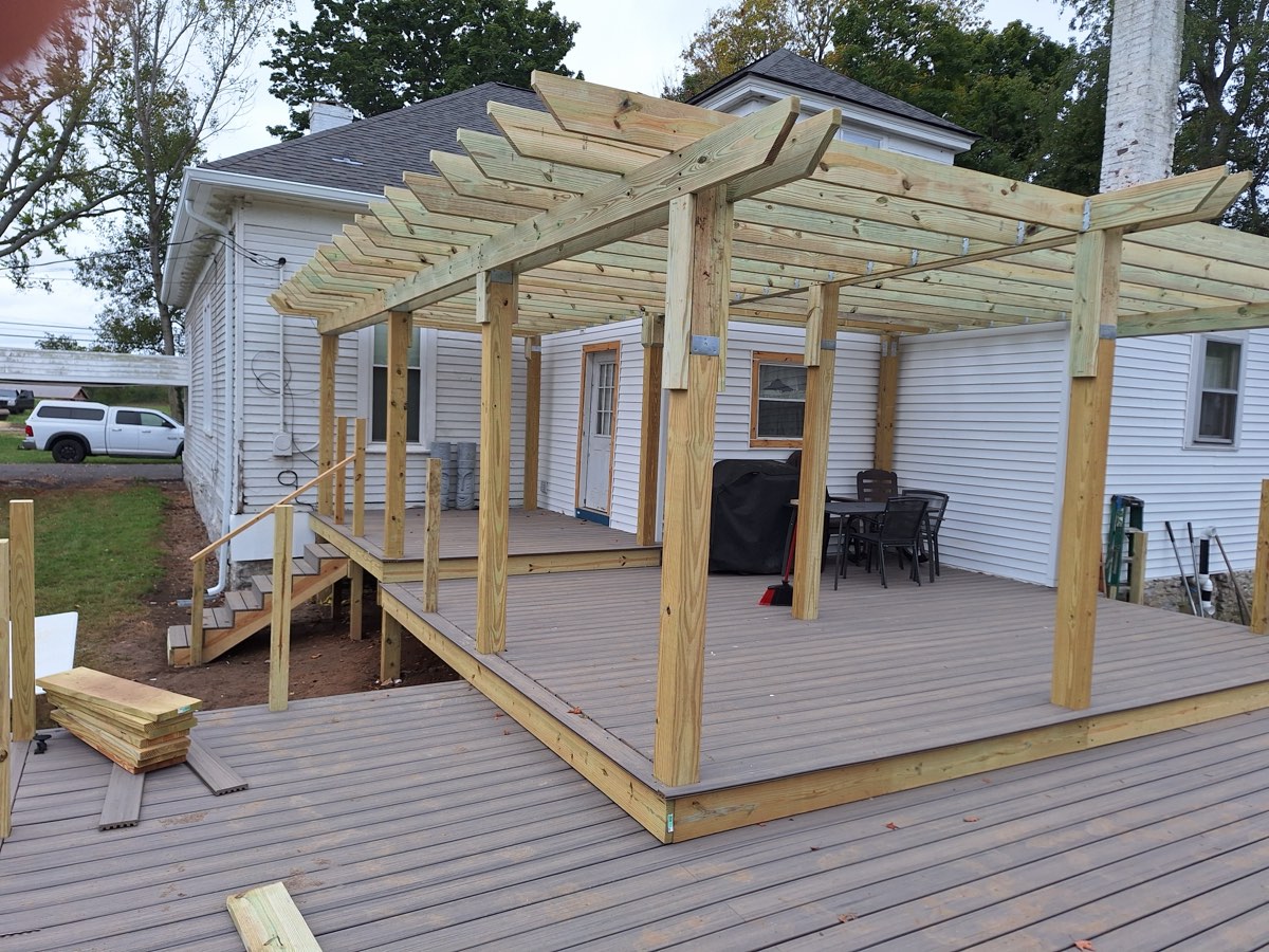 Composite decking down and the pergola standing over it